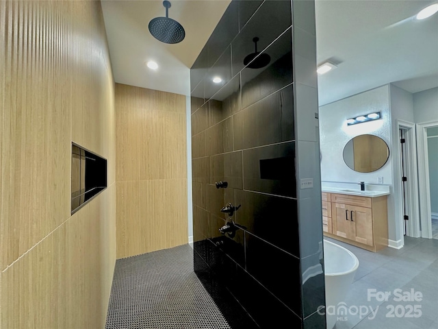 bathroom with recessed lighting, tile patterned flooring, tiled shower, a bath, and vanity