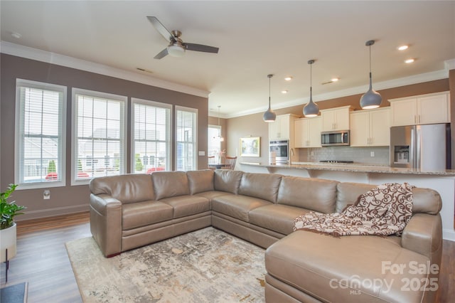 1638 Sweetmoss Loop, Denver, NC 28037 - living room with ornamental molding, ceiling fan, wood finished floors, and recessed lighting