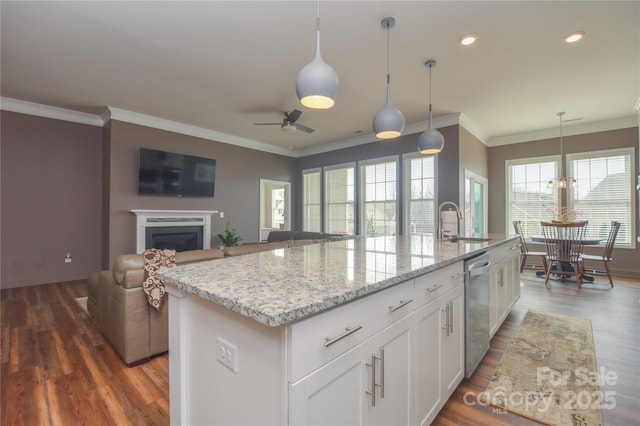 1638 Sweetmoss Loop, Denver, NC 28037 - kitchen with wood finished floors, a kitchen island with sink, dishwasher, open floor plan, and a ceiling fan
