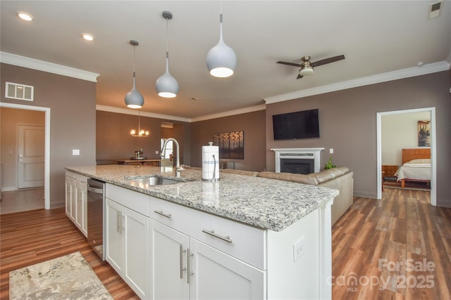 1638 Sweetmoss Loop, Denver, NC 28037 - kitchen with light wood-style flooring, ceiling fan, crown molding, white cabinetry, and pendant lighting