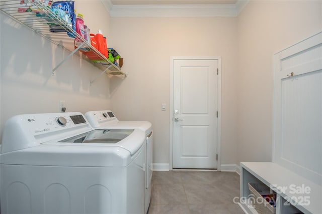 1638 Sweetmoss Loop, Denver, NC 28037 - washroom featuring washing machine and clothes dryer, crown molding, and light tile patterned floors