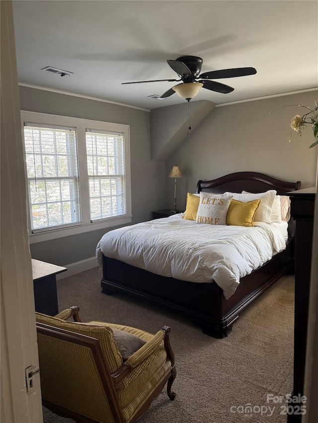 carpeted bedroom with baseboards, ceiling fan, and visible vents