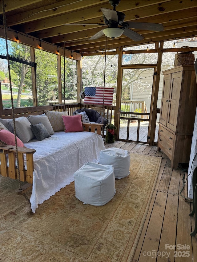 bedroom featuring access to exterior and light wood-style floors