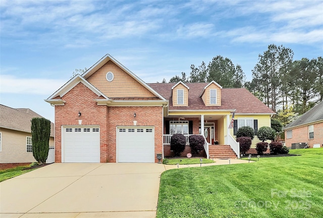 view of front of house featuring central AC unit, brick siding, covered porch, concrete driveway, and a front lawn