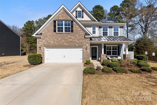 craftsman-style home with a standing seam roof, brick siding, a garage, and driveway