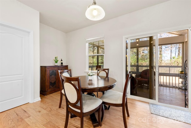 dining space with light wood-type flooring
