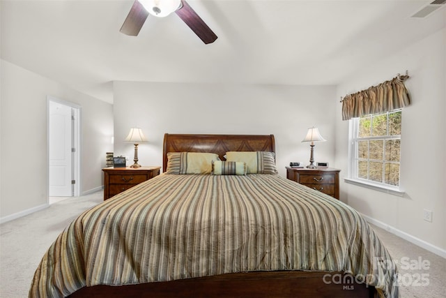 carpeted bedroom with baseboards, visible vents, and ceiling fan