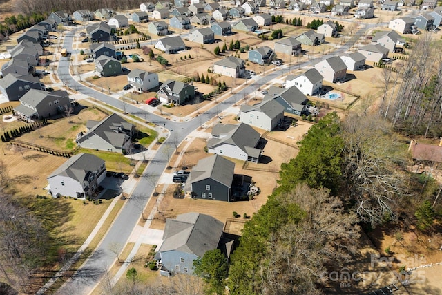 birds eye view of property with a residential view