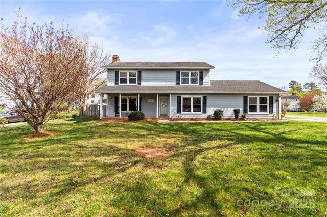 1448 Morrocroft Trl, Gastonia, NC 28054 - traditional-style house with a porch, a chimney, and a front yard