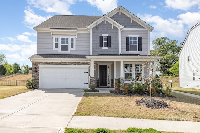 165 Winterberry St, Mooresville, NC 28117 - craftsman-style house featuring concrete driveway, a garage, stone siding, and a front lawn