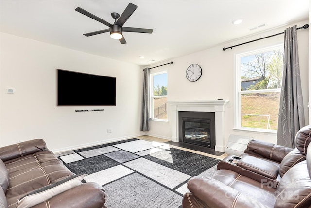165 Winterberry St, Mooresville, NC 28117 - living room with recessed lighting, a fireplace with flush hearth, a ceiling fan, and a healthy amount of sunlight