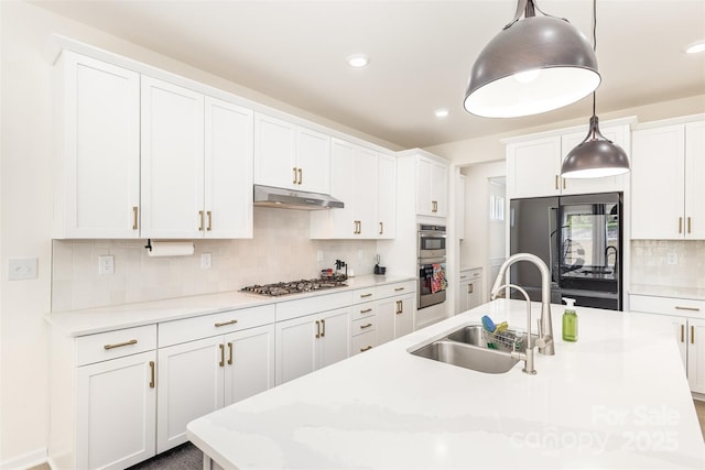 165 Winterberry St, Mooresville, NC 28117 - kitchen with tasteful backsplash, white cabinetry, appliances with stainless steel finishes, under cabinet range hood, and a sink