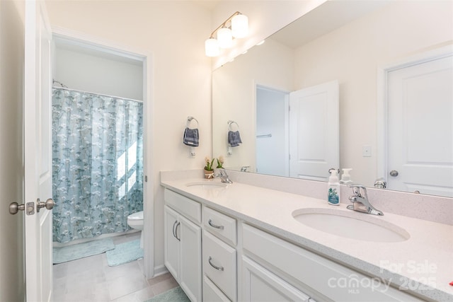165 Winterberry St, Mooresville, NC 28117 - bathroom featuring tile patterned floors, double vanity, a sink, and toilet