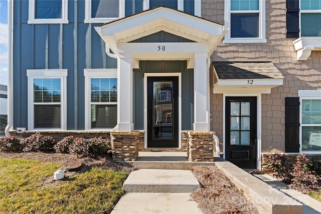 view of exterior entry with board and batten siding