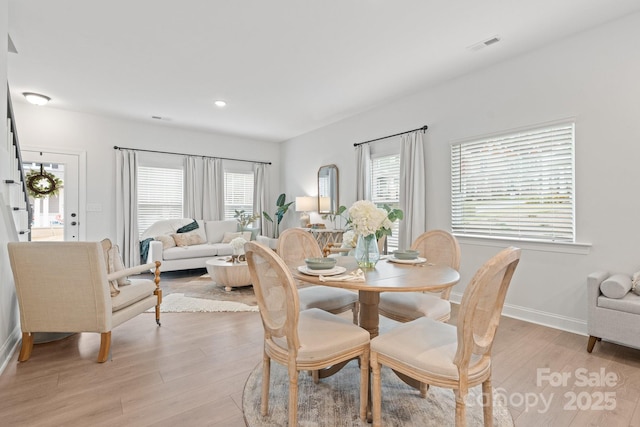 dining room with visible vents, recessed lighting, baseboards, and light wood-style floors
