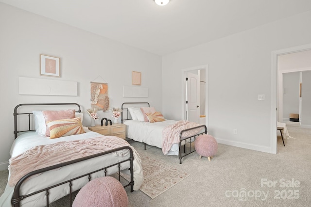 bedroom featuring baseboards and carpet floors