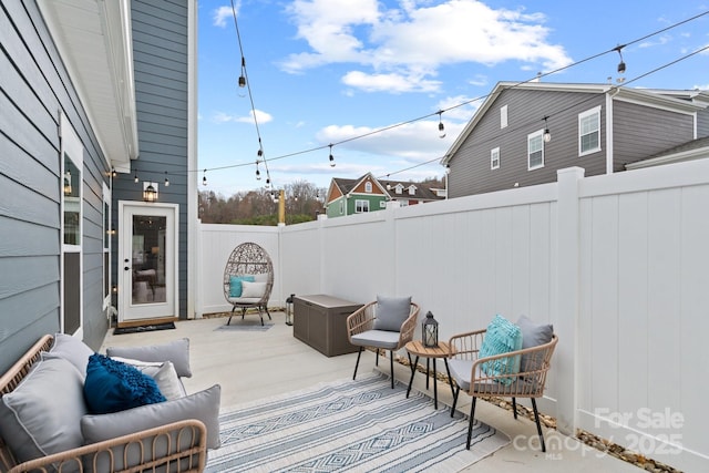 view of patio / terrace featuring an outdoor living space and a fenced backyard
