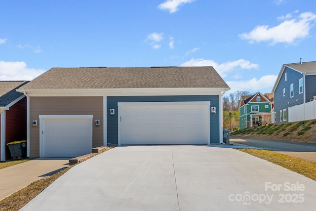 garage with concrete driveway