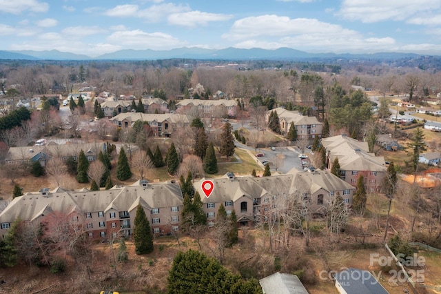 drone / aerial view with a residential view and a mountain view