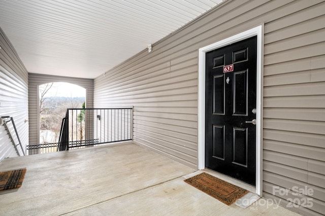 doorway to property featuring a balcony