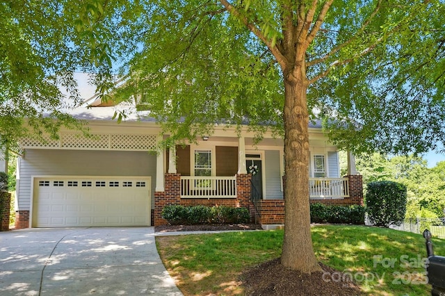 8008 Battersea Ct, Waxhaw, NC 28173 - view of front of property with a porch, brick siding, an attached garage, and driveway