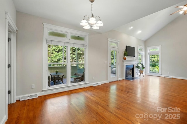 8008 Battersea Ct, Waxhaw, NC 28173 - unfurnished living room with visible vents, a glass covered fireplace, and wood finished floors