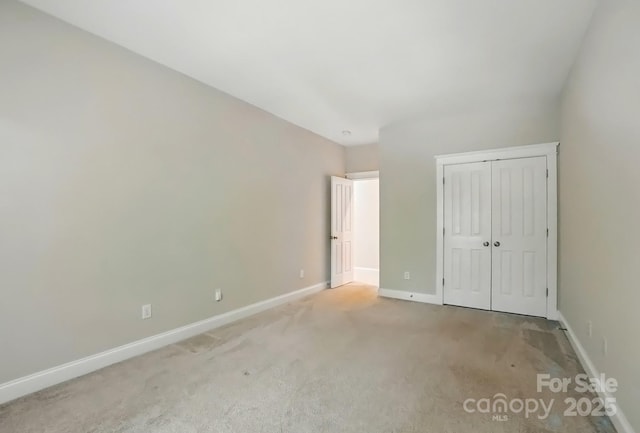 8008 Battersea Ct, Waxhaw, NC 28173 - unfurnished bedroom featuring baseboards, carpet, and a closet