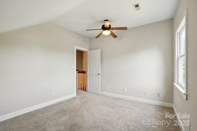 8008 Battersea Ct, Waxhaw, NC 28173 - unfurnished room with ceiling fan, light carpet, baseboards, vaulted ceiling, and visible vents