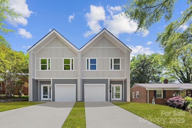 view of front of property featuring a front lawn, brick siding, a garage, board and batten siding, and concrete driveway