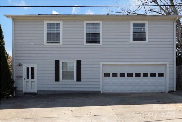 view of front of house with an attached garage and concrete driveway