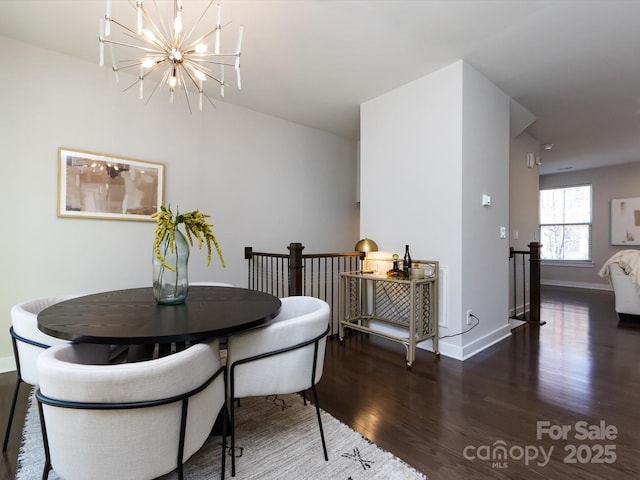 1814 Shumard Ln, Charlotte, NC 28205 - dining area with a notable chandelier, wood finished floors, and baseboards