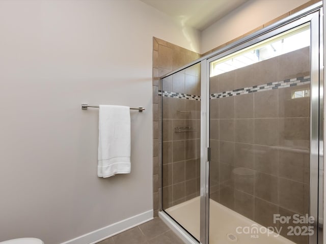 1814 Shumard Ln, Charlotte, NC 28205 - bathroom with tile patterned flooring, a shower stall, and baseboards