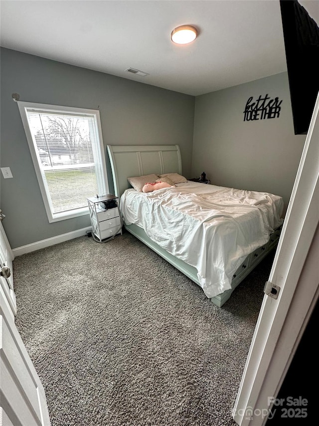 bedroom with visible vents, baseboards, and carpet floors