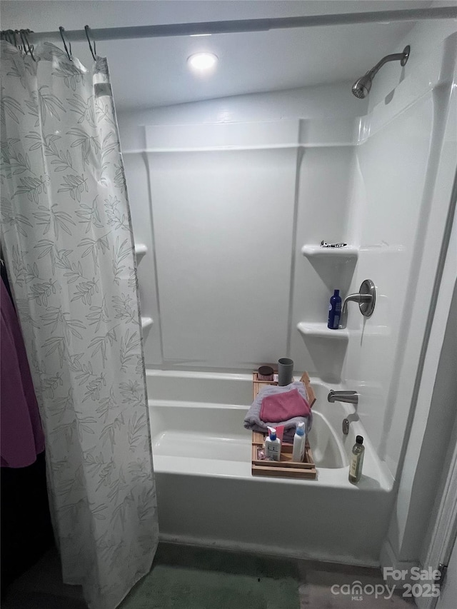 full bathroom with shower / bath combo with shower curtain