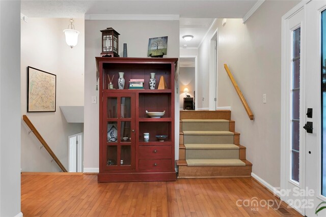 95 Ridgewood Pl, Brevard, NC 28712 - stairs with wood-type flooring, crown molding, and baseboards