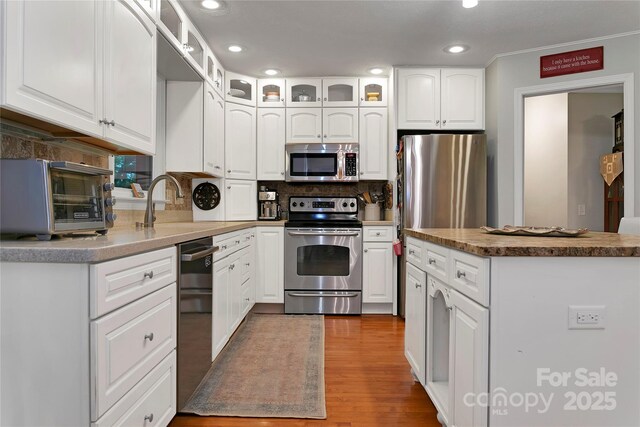 95 Ridgewood Pl, Brevard, NC 28712 - kitchen featuring stainless steel appliances, tasteful backsplash, recessed lighting, white cabinets, and a sink