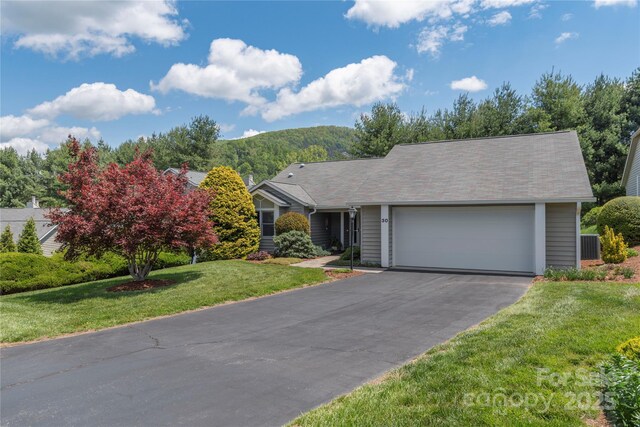 30 Cedarcliff Cir, Asheville, NC 28803 - view of front of property featuring driveway, an attached garage, a front lawn, a mountain view, and central AC