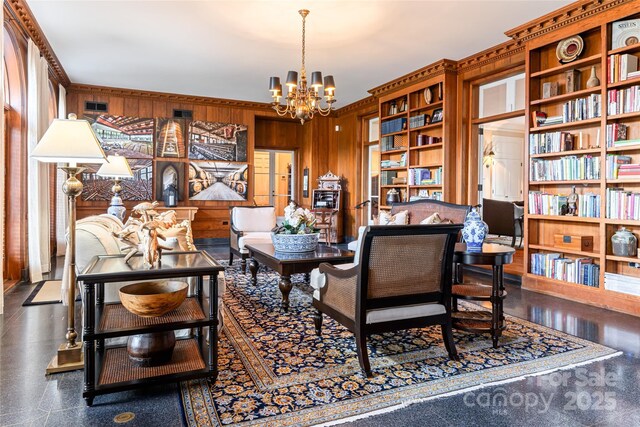 living area with wooden walls and a notable chandelier