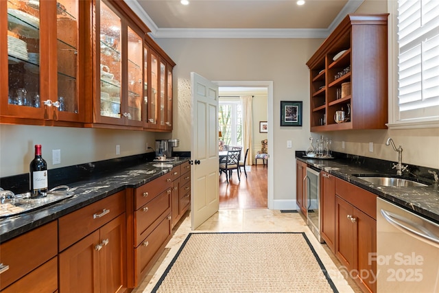 kitchen featuring ornamental molding, open shelves, dark stone counters, stainless steel dishwasher, and a sink