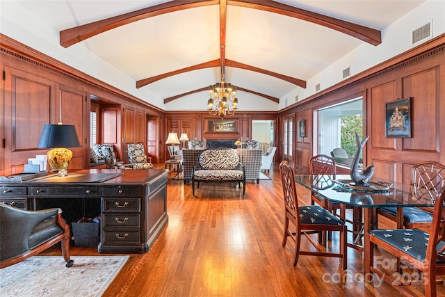 office with a chandelier, wood-type flooring, vaulted ceiling with beams, and visible vents