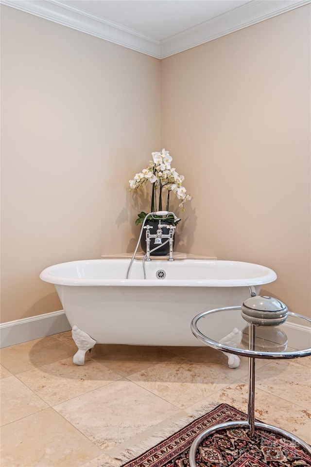 interior space with ornamental molding, baseboards, a soaking tub, and tile patterned flooring