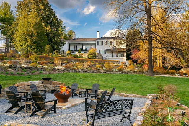 view of yard featuring a patio area and an outdoor fire pit