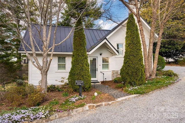 view of front of home featuring a standing seam roof and metal roof