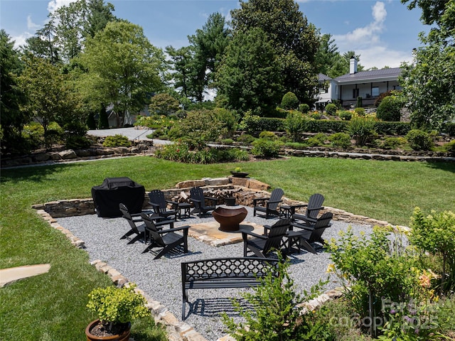 365 Sherwood Dr S, Flat Rock, NC 28731 - view of green lawn featuring a fire pit and a patio area