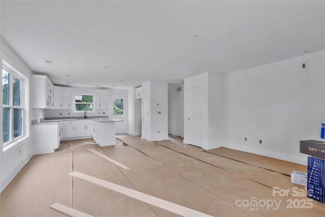 513 Harrel St, Salisbury, NC 28144 - unfurnished living room featuring baseboards