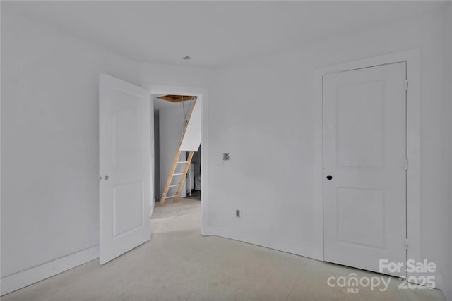 513 Harrel St, Salisbury, NC 28144 - unfurnished bedroom with unfinished concrete flooring and baseboards