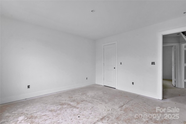 513 Harrel St, Salisbury, NC 28144 - unfurnished bedroom with unfinished concrete floors and baseboards