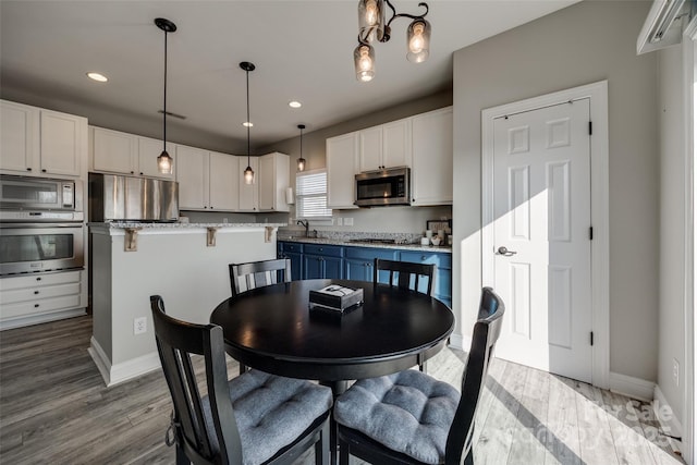 10071 Highland Creek Cir, Indian Land, SC 29707 - dining space featuring wood finished floors, baseboards, and recessed lighting