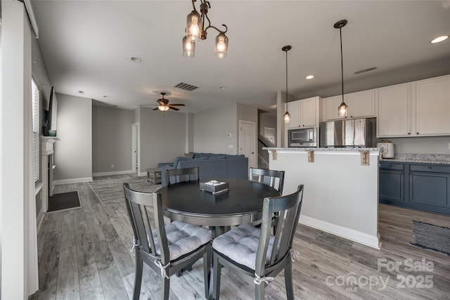 10071 Highland Creek Cir, Indian Land, SC 29707 - dining room with visible vents, light wood-style flooring, recessed lighting, and a ceiling fan