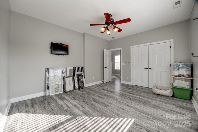 10071 Highland Creek Cir, Indian Land, SC 29707 - entryway with visible vents, baseboards, a ceiling fan, and wood finished floors